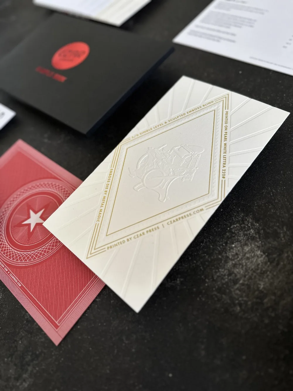 Czar Press sample pack: folder, blind-embossed card on Crane's Lettra, and a red printed card